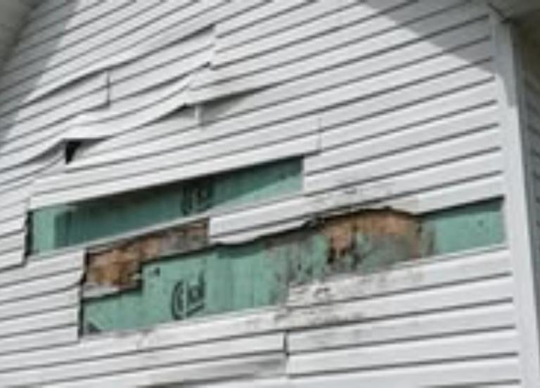 signs of water behind siding